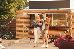 couple at a food truck as one of the unique anniversary ideas to consider